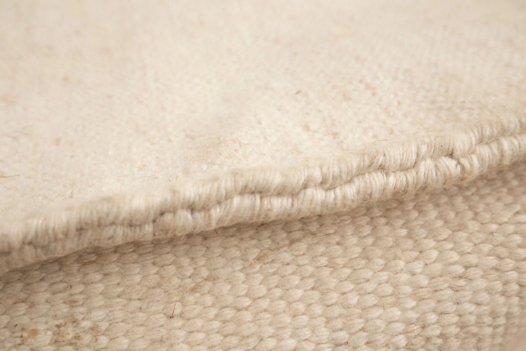 The Boite Wool/Bamboo Bean Bag Ottoman in Beige